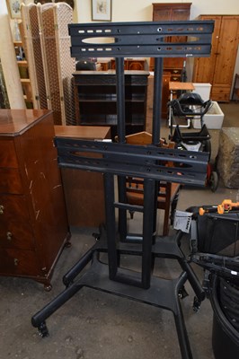 Lot 866 - Two metal free standing flat screen television...