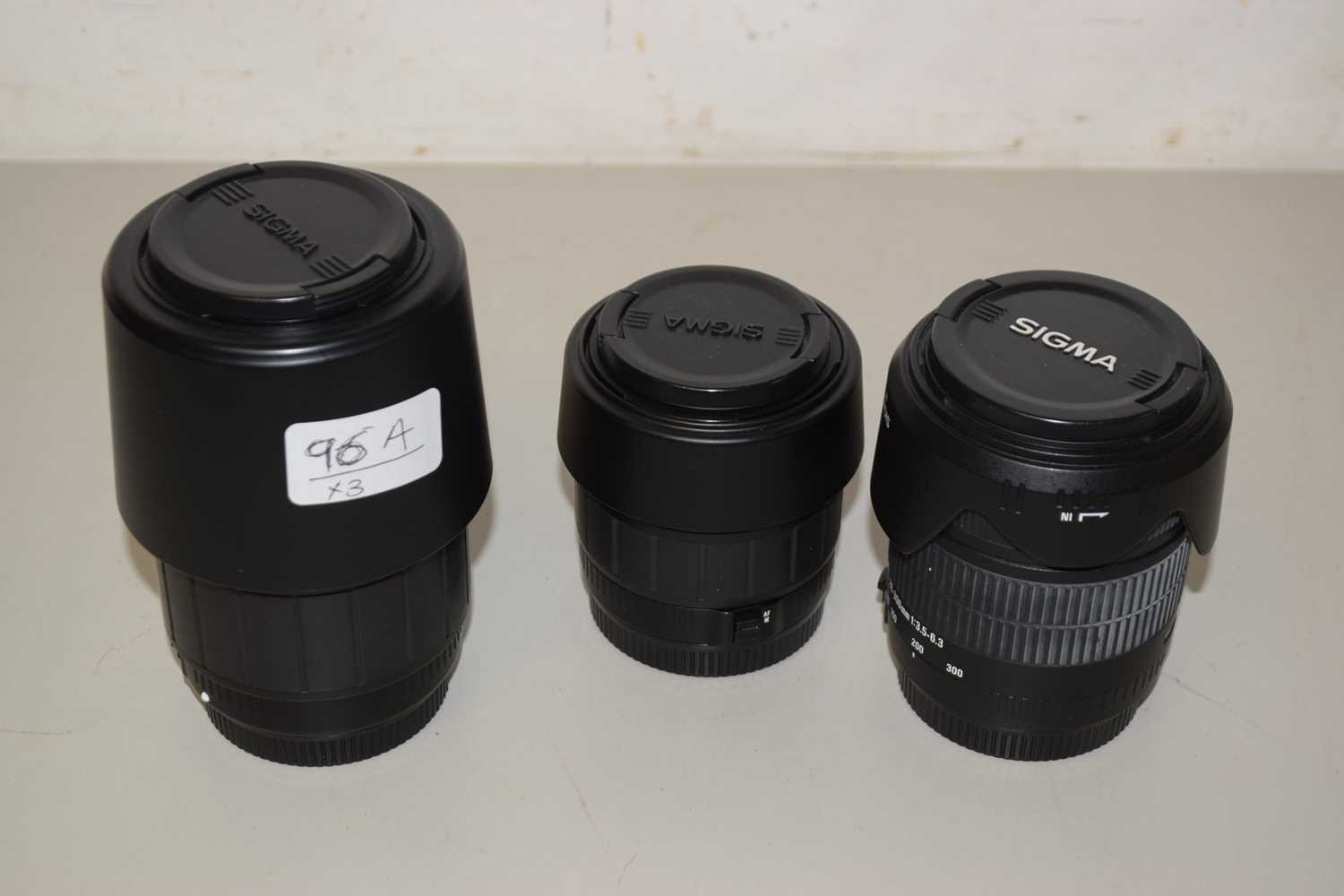 Lot 96 - Three Sigma lenses including a 70-300mm DL...