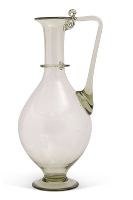 Lot 160 - A Roman glass ewer or carafe 29cm high - NOTE:...