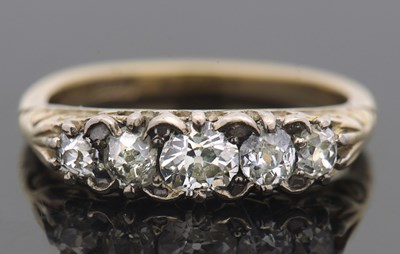 Lot 385 - An 18ct five stone diamond ring, the five...