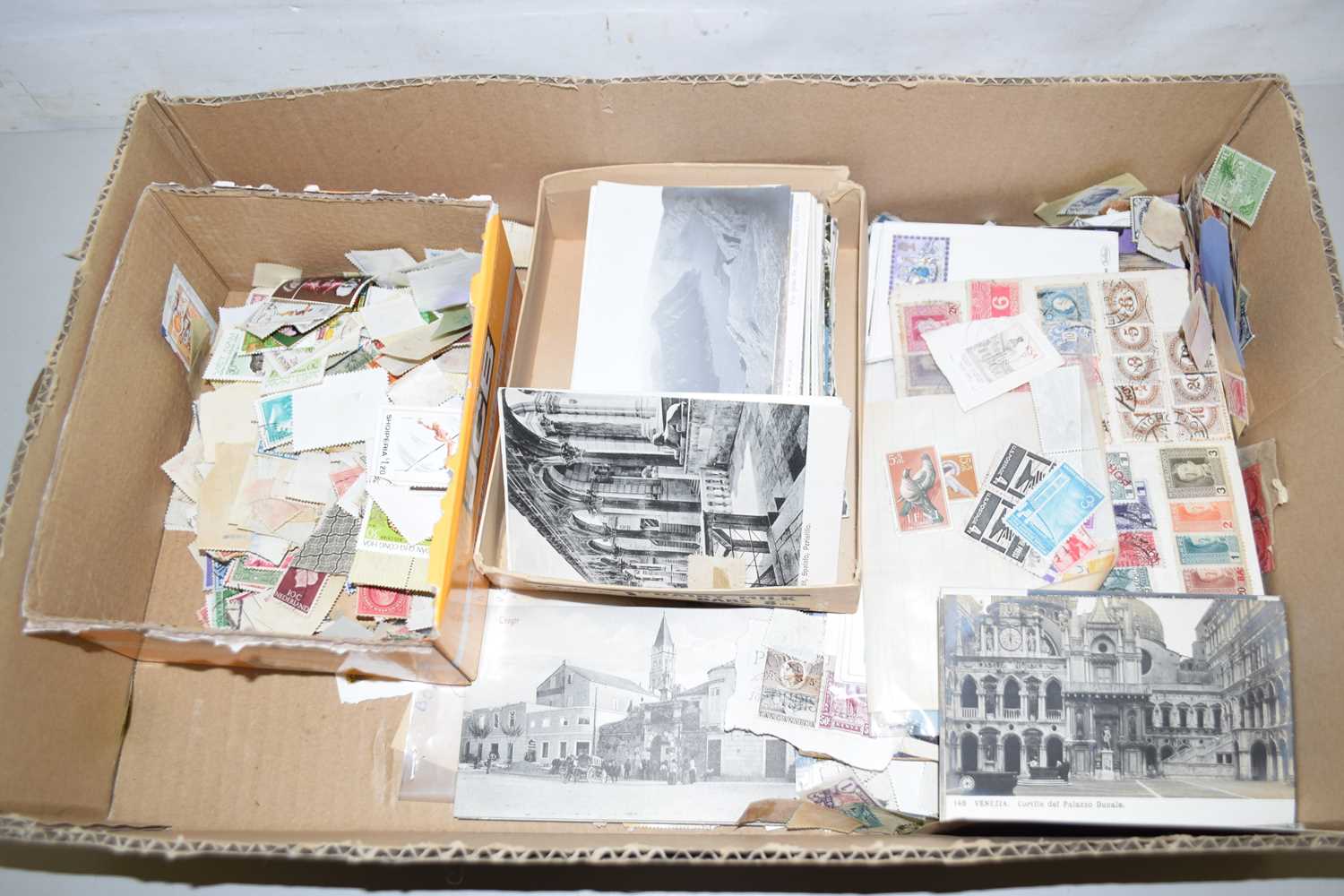 Lot 77 - Box of various world stamps, postcards etc