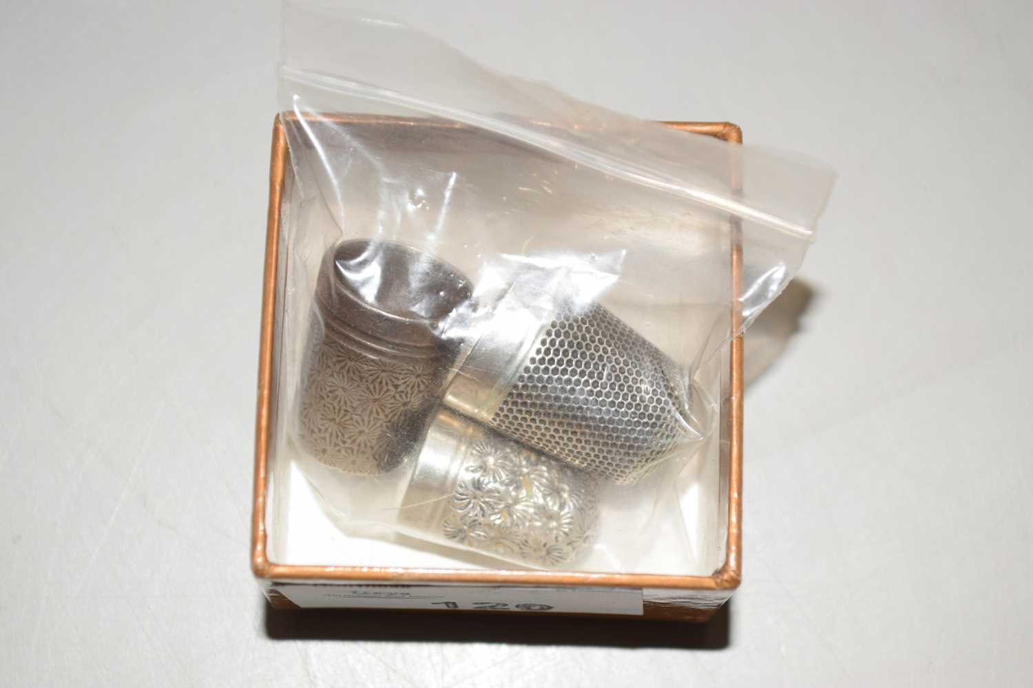 Lot 120 - A group of three thimbles