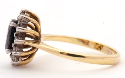 Lot 3 - An 18ct sapphire and diamond cluster ring, the...