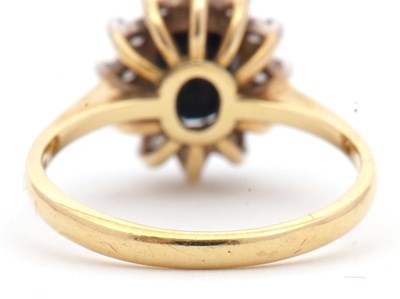 Lot 3 - An 18ct sapphire and diamond cluster ring, the...