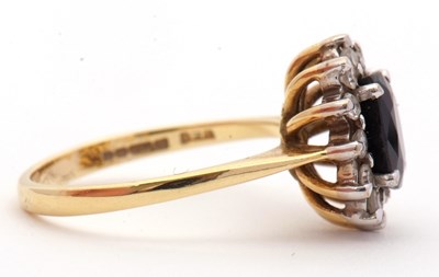 Lot 3 - An 18ct sapphire and diamond cluster ring, the...