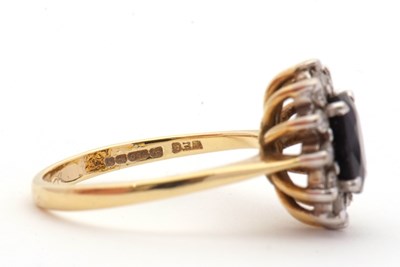 Lot 3 - An 18ct sapphire and diamond cluster ring, the...