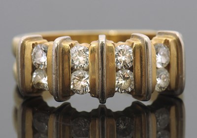 Lot 430 - An 18ct diamond ring, set with four pairs of...