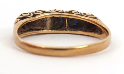 Lot 24 - A 9ct five stone sapphire ring, the slightly...