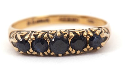 Lot 24 - A 9ct five stone sapphire ring, the slightly...