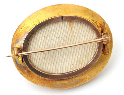 Lot 55 - An Archeological revival brooch, with central...