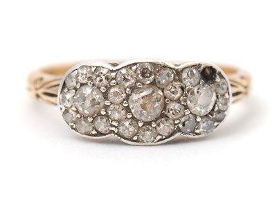 Lot 2 - A diamond cluster ring, with three small...
