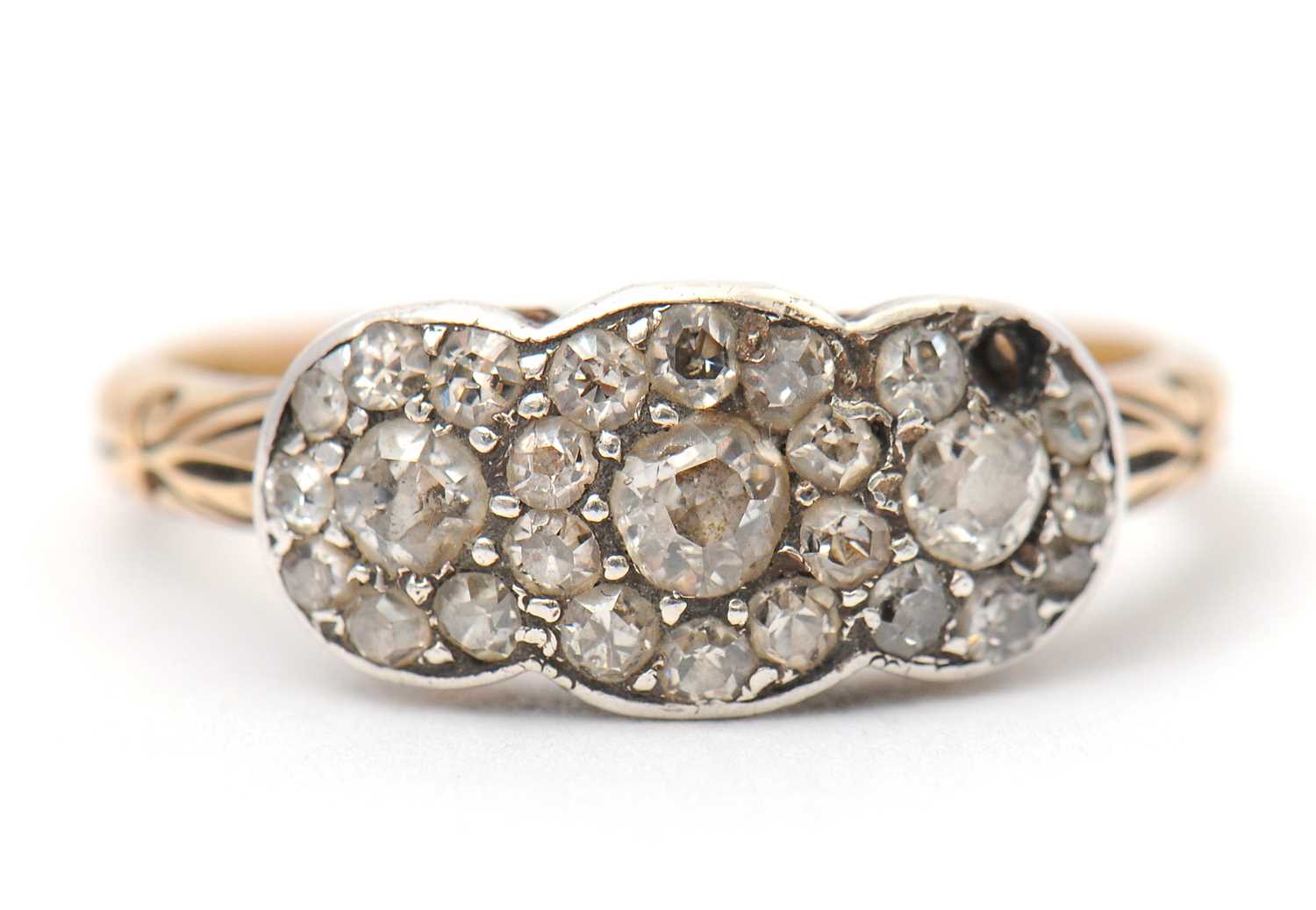 Lot 2 - A diamond cluster ring, with three small...
