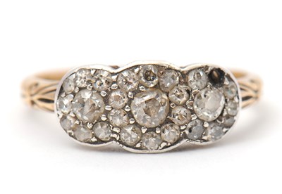 Lot 2 - A diamond cluster ring, with three small...