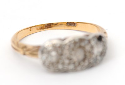 Lot 2 - A diamond cluster ring, with three small...