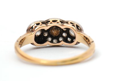 Lot 2 - A diamond cluster ring, with three small...