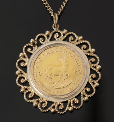 Lot 444 - A 1/10th Krugerrand pendant and chain, the...