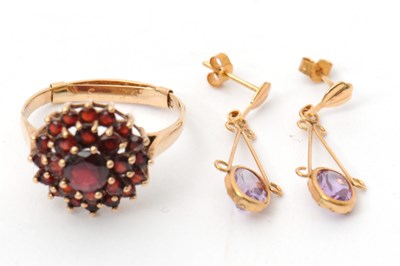 Lot 49 - A 9ct garnet cluster ring, with plain band...