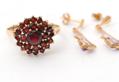 Lot 49 - A 9ct garnet cluster ring, with plain band...