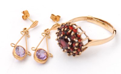 Lot 49 - A 9ct garnet cluster ring, with plain band...
