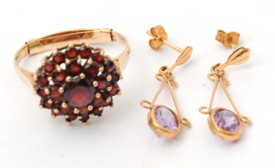 Lot 49 - A 9ct garnet cluster ring, with plain band...