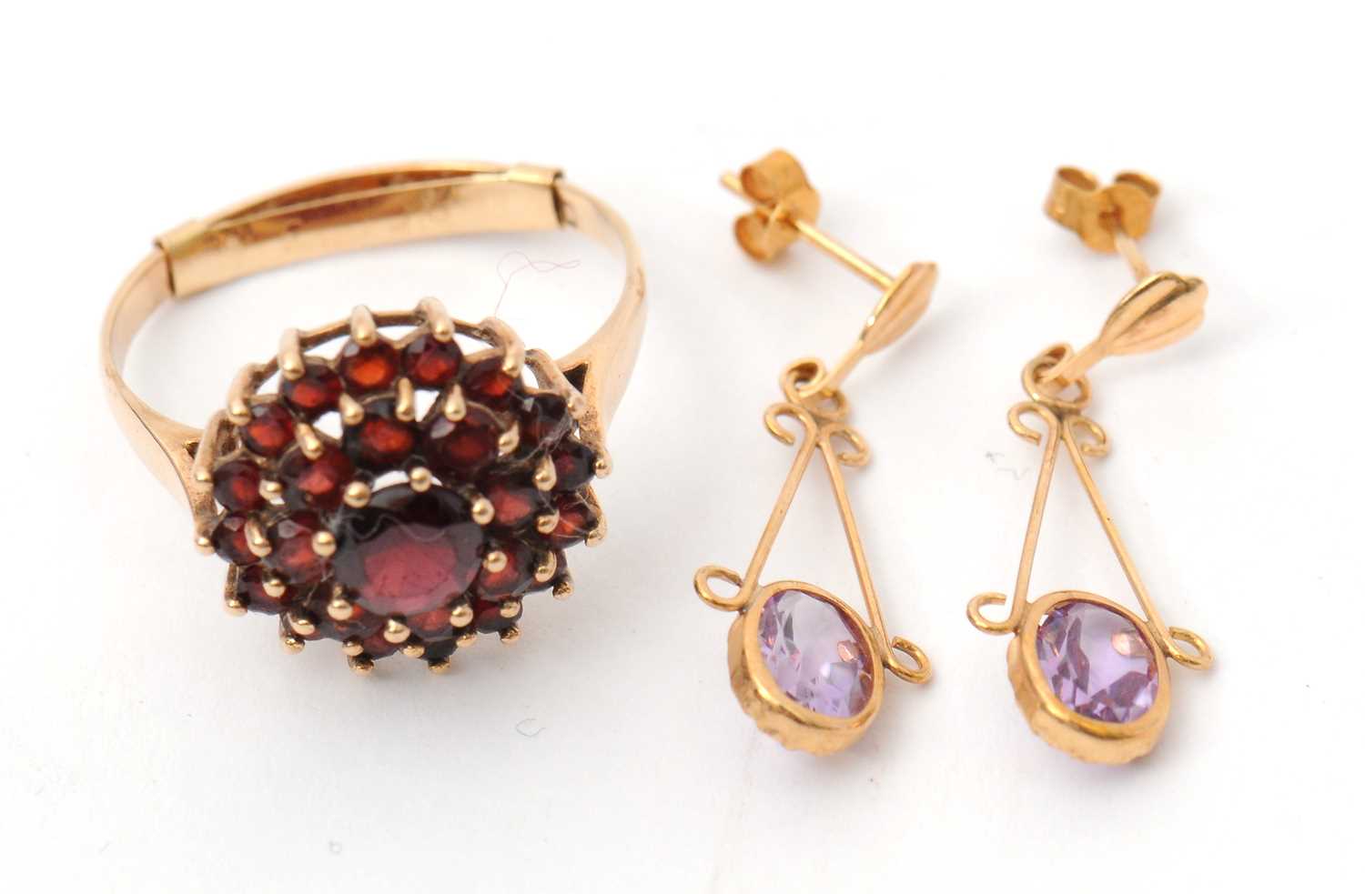 Lot 49 - A 9ct garnet cluster ring, with plain band...
