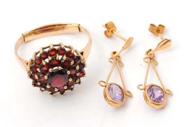 Lot 49 - A 9ct garnet cluster ring, with plain band...