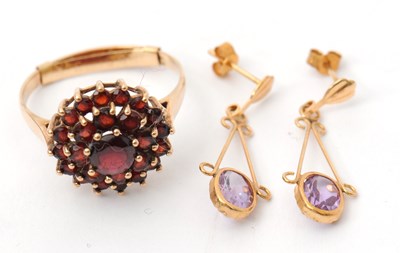 Lot 49 - A 9ct garnet cluster ring, with plain band...