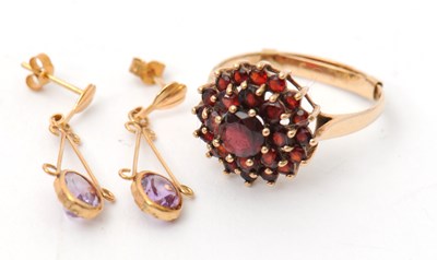 Lot 49 - A 9ct garnet cluster ring, with plain band...