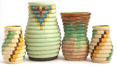 Lot 11 - A group of four Clarice Cliff raffia vases...
