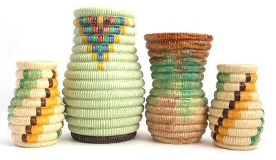 Lot 11 - A group of four Clarice Cliff raffia vases...