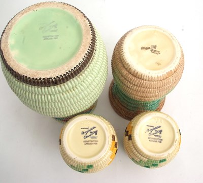 Lot 11 - A group of four Clarice Cliff raffia vases...