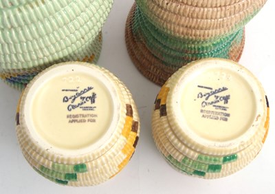 Lot 11 - A group of four Clarice Cliff raffia vases...