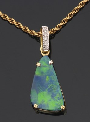 Lot 403 - An 18ct opal and diamond pendant, the...