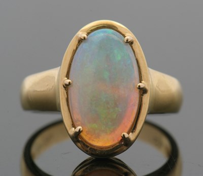 Lot 12 - An opal ring, the oval opal cabochon, approx....