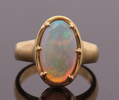 Lot 12 - An opal ring, the oval opal cabochon, approx....