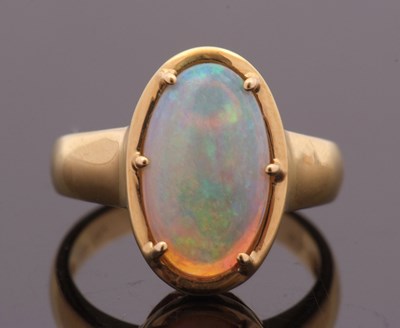 Lot 12 - An opal ring, the oval opal cabochon, approx....