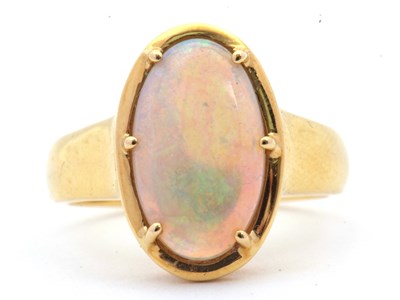 Lot 12 - An opal ring, the oval opal cabochon, approx....