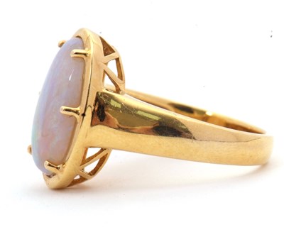 Lot 12 - An opal ring, the oval opal cabochon, approx....