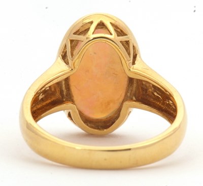Lot 12 - An opal ring, the oval opal cabochon, approx....