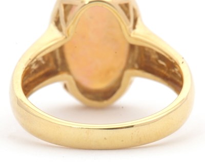 Lot 12 - An opal ring, the oval opal cabochon, approx....