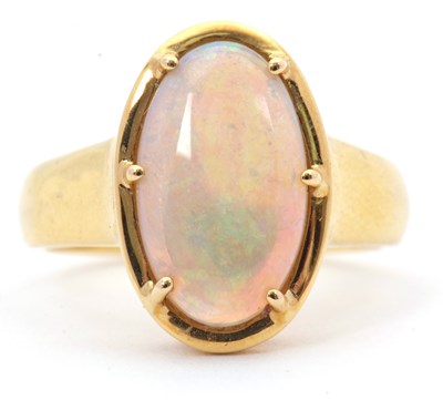 Lot 12 - An opal ring, the oval opal cabochon, approx....