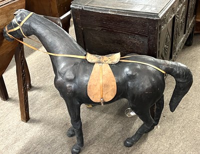 Lot 410 - A Liberty style leather horse