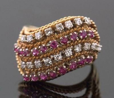 Lot 419 - An 18ct diamond and ruby ring, set with four...