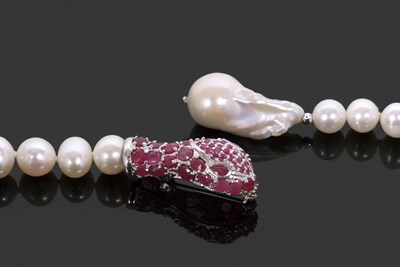 Lot 414 - A cultured pearl and ruby snake head lanyard...