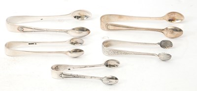 Lot 66 - Five pairs of silver sugar tongs, various...