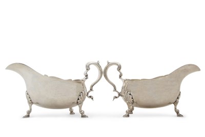 Lot 331 - A pair of George VI large silver sauce boats...
