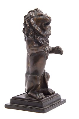 Lot 453 - A 20th Century bronze model of a rampant lion ,...