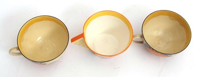 Lot 10 - Two Clarice Cliff cups and saucers in the Gay...