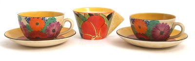 Lot 10 - Two Clarice Cliff cups and saucers in the Gay...