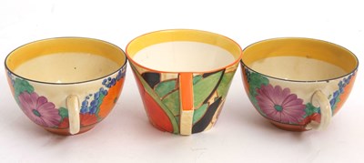 Lot 10 - Two Clarice Cliff cups and saucers in the Gay...